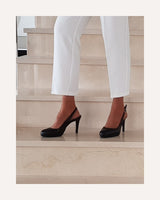 Zapatos de salón destalonados Cassani  en piel negra. Tacón alto con plataforma